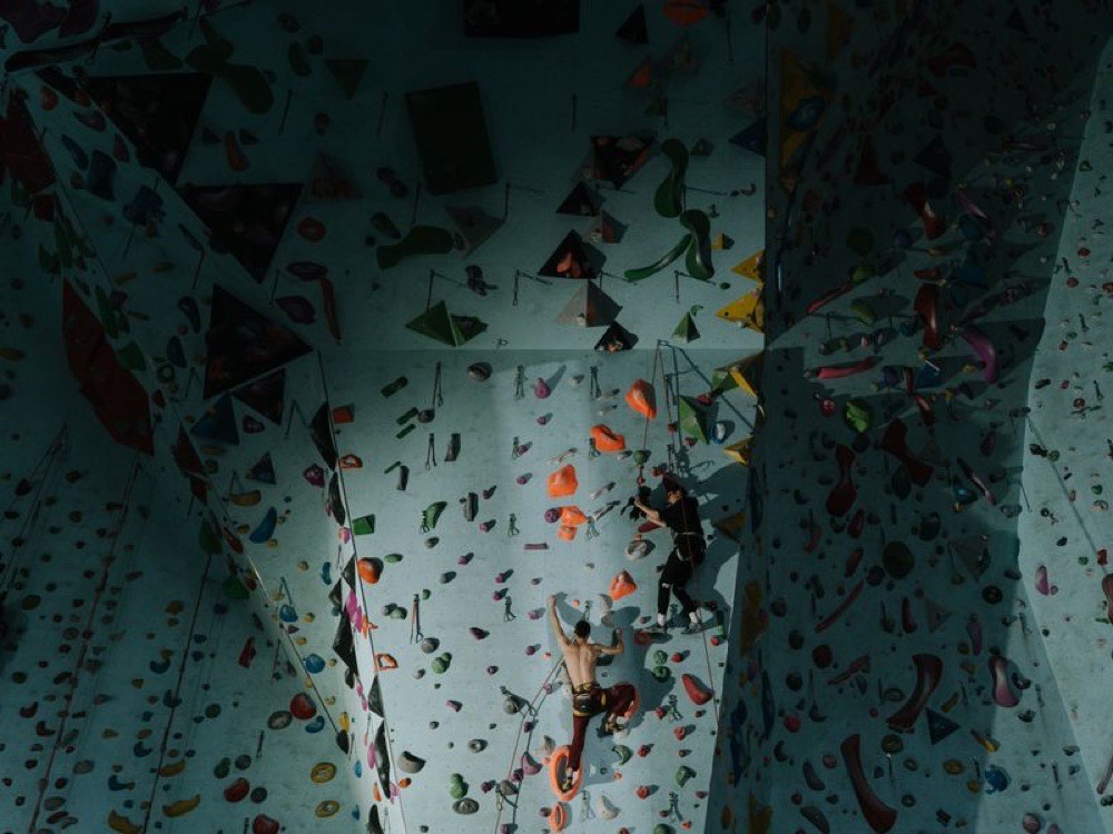 People on an indoor climbing wall